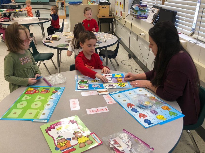 Neshoba Central pre-kindergarten teacher Priscilla Drury works with
students Harper Henley and Arlie Burks. Drury teaches one of two Title
1 pre-k classes at Neshoba. The program will expand to four classes
during the 2023-24 school year.